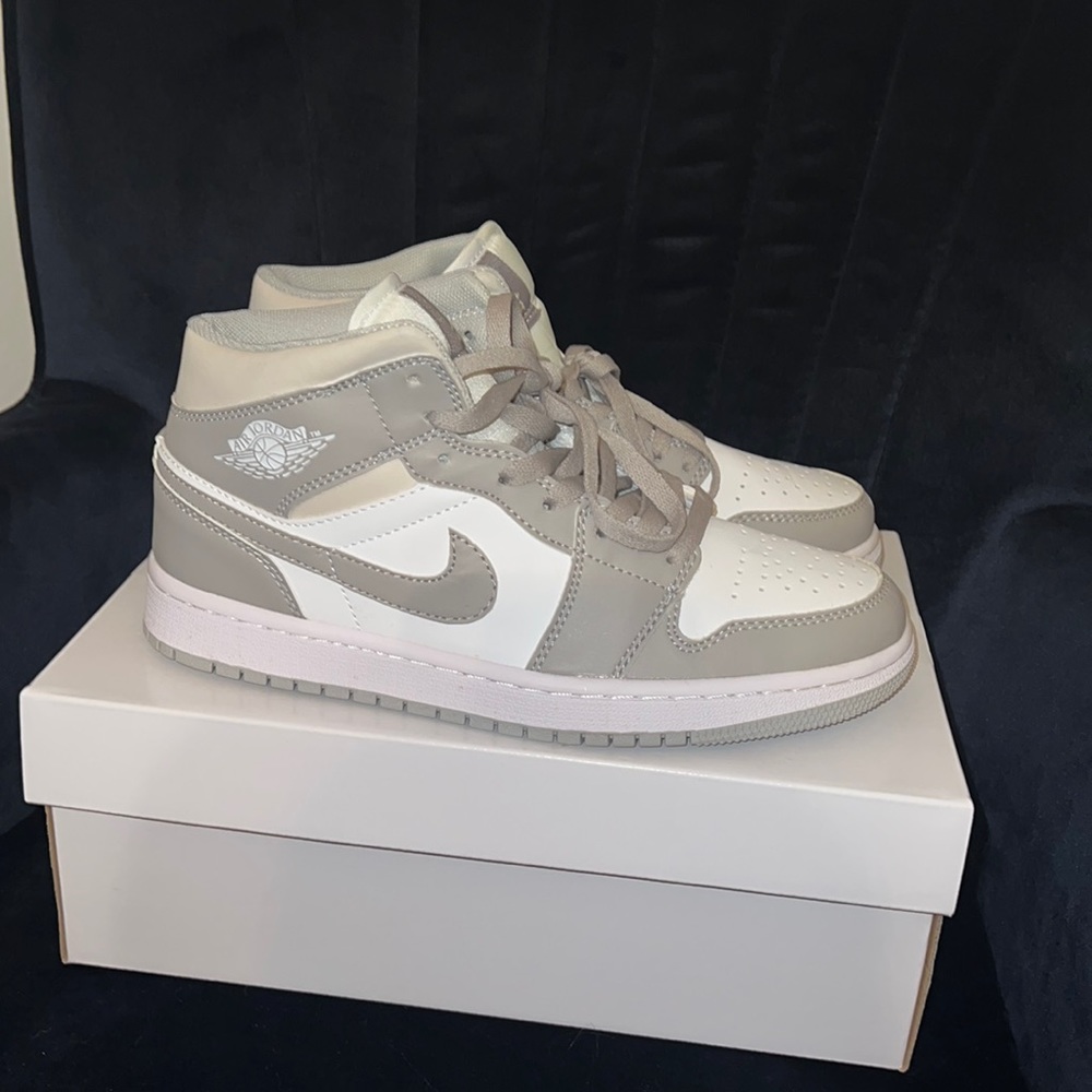 Size women’s 9.5 Air Jordan 1 mid.